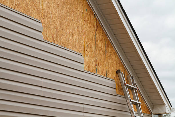 Professional Storm Damage Siding Repair technician working in Carversville, PA